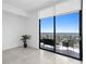Bright bedroom with sliding doors leading to a balcony with city views at 2912 W Santiago St # 2104, Tampa, FL 33629