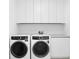 Bright laundry room with white cabinets and new appliances at 2912 W Santiago St # 2104, Tampa, FL 33629