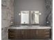 Double vanity bathroom with marble countertops and gray tile at 2912 W Santiago St # 2104, Tampa, FL 33629