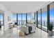 Bright living room with stunning water views and floor-to-ceiling windows at 2912 W Santiago St # 2104, Tampa, FL 33629
