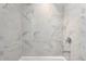 Clean shower with marble-look tile at 2912 W Santiago St # 2104, Tampa, FL 33629