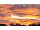 Stunning sunset with warm orange and yellow tones at 8818 Bay Pointe Dr # 108, Tampa, FL 33615