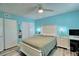 Bedroom with light teal walls, a plush bed, and ample closet space at 8818 Bay Pointe Dr # 108, Tampa, FL 33615