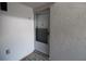 Front door entrance with storm door and tiled flooring at 8818 Bay Pointe Dr # 108, Tampa, FL 33615