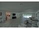 Community room features a kitchen, TV, seating area, and pool view at 8818 Bay Pointe Dr # 108, Tampa, FL 33615