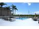 Relaxing pool area with lounge chairs and tables at 8818 Bay Pointe Dr # 108, Tampa, FL 33615