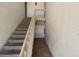Indoor stairwell with carpeted steps and tiled flooring at 8818 Bay Pointe Dr # 108, Tampa, FL 33615