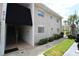Building exterior showcasing entrance, landscaping, and walkway at 8818 Bay Pointe Dr # 108, Tampa, FL 33615