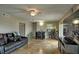 Living room with tile flooring, large TV, and access to a patio at 8818 Bay Pointe Dr # 108, Tampa, FL 33615
