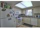 Kitchen with white cabinets, granite countertops and appliances at 8818 Bay Pointe Dr # 108, Tampa, FL 33615