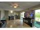 Living room with water views, large TV and comfortable seating at 8818 Bay Pointe Dr # 108, Tampa, FL 33615