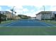 Full-size tennis court with basketball court nearby at 8818 Bay Pointe Dr # 108, Tampa, FL 33615