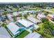 Wide aerial view of a waterfront community featuring various houses and lush greenery at 567 Bimini Bay Blvd, Apollo Beach, FL 33572