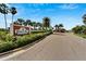 Entrance to Bimini Bay, a coastal community featuring lush landscaping and palm trees at 567 Bimini Bay Blvd, Apollo Beach, FL 33572