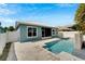 Back exterior view of the home with pool and patio at 567 Bimini Bay Blvd, Apollo Beach, FL 33572