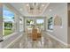 Bright dining room with large windows and seating for four at 567 Bimini Bay Blvd, Apollo Beach, FL 33572