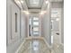 Bright entryway with tile flooring, modern chandelier, and recessed lighting at 567 Bimini Bay Blvd, Apollo Beach, FL 33572