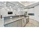 Modern kitchen with island, granite countertops, and stainless steel appliances at 567 Bimini Bay Blvd, Apollo Beach, FL 33572