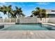 Modern pool and patio area with a sleek water feature at 567 Bimini Bay Blvd, Apollo Beach, FL 33572