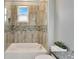 Updated bathroom with a tub and shower combination at 567 Bimini Bay Blvd, Apollo Beach, FL 33572