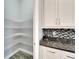 Well-organized pantry with ample shelving for storage at 567 Bimini Bay Blvd, Apollo Beach, FL 33572