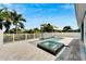 Stunning pool and spa with a water feature, surrounded by a spacious patio at 567 Bimini Bay Blvd, Apollo Beach, FL 33572