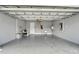 Spacious garage with attic access, sink, and extra storage at 567 Bimini Bay Blvd, Apollo Beach, FL 33572