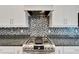 Modern kitchen with gas stove and granite countertops at 567 Bimini Bay Blvd, Apollo Beach, FL 33572