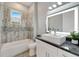 Clean bathroom with a granite vanity and updated fixtures at 567 Bimini Bay Blvd, Apollo Beach, FL 33572