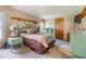 Cozy bedroom with wood-paneled walls and a double bed at 37743 Mission Hills Ave, Zephyrhills, FL 33541