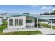 Quaint single wide mobile home with carport and landscaping at 37743 Mission Hills Ave, Zephyrhills, FL 33541