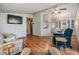 Bright living room with hardwood floors and comfy seating at 37743 Mission Hills Ave, Zephyrhills, FL 33541