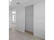 Bright bedroom with spacious closet and light wood flooring at 6999 Burnsville St, Englewood, FL 34224