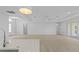 Open kitchen island with white cabinets and stainless steel appliances at 6999 Burnsville St, Englewood, FL 34224