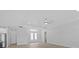 Spacious living room with high ceilings and a ceiling fan at 6999 Burnsville St, Englewood, FL 34224