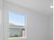 Bright bedroom with a window overlooking the backyard at 6999 Burnsville St, Englewood, FL 34224