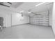 Finished garage with epoxy flooring and overhead storage at 6999 Burnsville St, Englewood, FL 34224