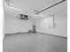 Finished garage with epoxy flooring and overhead storage at 6999 Burnsville St, Englewood, FL 34224