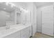 Elegant bathroom with dual sinks and white cabinetry at 6999 Burnsville St, Englewood, FL 34224