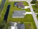 Aerial view showing the home's size and lot in relation to others at 6999 Burnsville St, Englewood, FL 34224