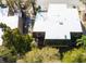 Aerial view of the building's roof, lush landscaping, and the neighboring buildings at 12703 Tall Pine Dr, Tampa, FL 33625