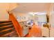 Living room with wood floors, comfortable seating, and stairs to the second story at 12703 Tall Pine Dr, Tampa, FL 33625