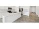 Beautiful open kitchen boasts modern stainless steel appliances and a large, functional center island at 4265 Big Sky Dr, Spring Hill, FL 34604