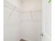 A walk-in closet with wire shelving and neutral carpeting at 4265 Big Sky Dr, Spring Hill, FL 34604