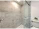 Clean shower with grey tile and a frameless glass enclosure at 1028 Apollo Beach Blvd # 4, Apollo Beach, FL 33572
