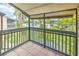 Private balcony overlooking the community pool and lush landscaping at 1028 Apollo Beach Blvd # 4, Apollo Beach, FL 33572