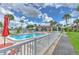 Community pool with surrounding patio furniture and walkway at 1028 Apollo Beach Blvd # 4, Apollo Beach, FL 33572