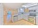 Updated kitchen with stainless steel appliances and light wood floors at 1028 Apollo Beach Blvd # 4, Apollo Beach, FL 33572
