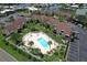 Community pool and surrounding buildings in an aerial view at 1028 Apollo Beach Blvd # 4, Apollo Beach, FL 33572