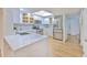 Modern kitchen with white cabinets, quartz countertops, and stainless steel appliances at 1028 Apollo Beach Blvd # 4, Apollo Beach, FL 33572